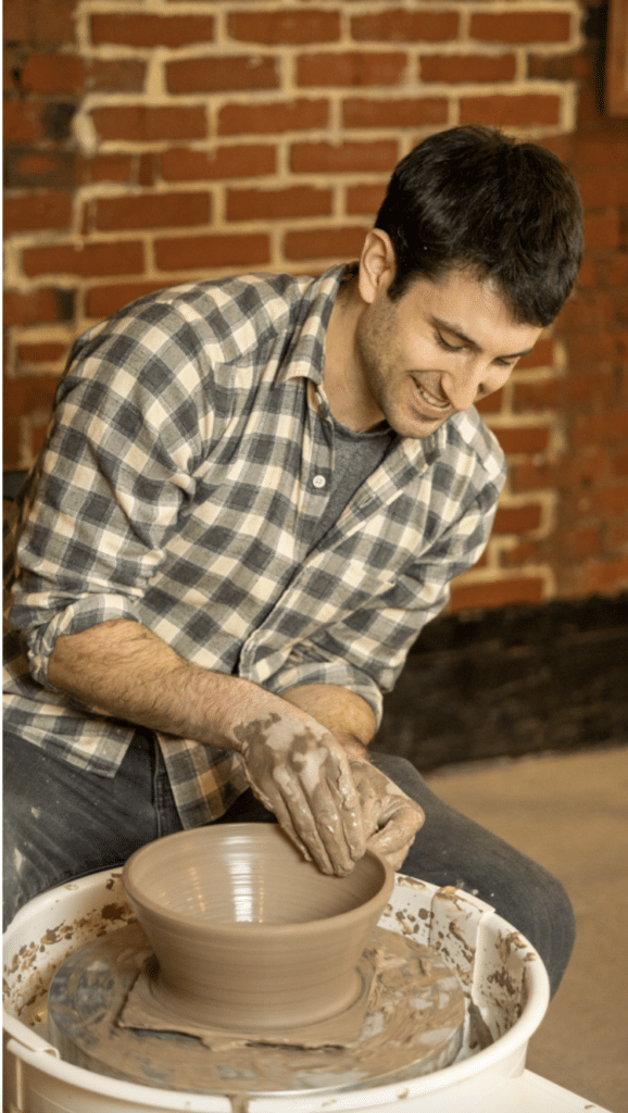 clay lounge potter at wheel